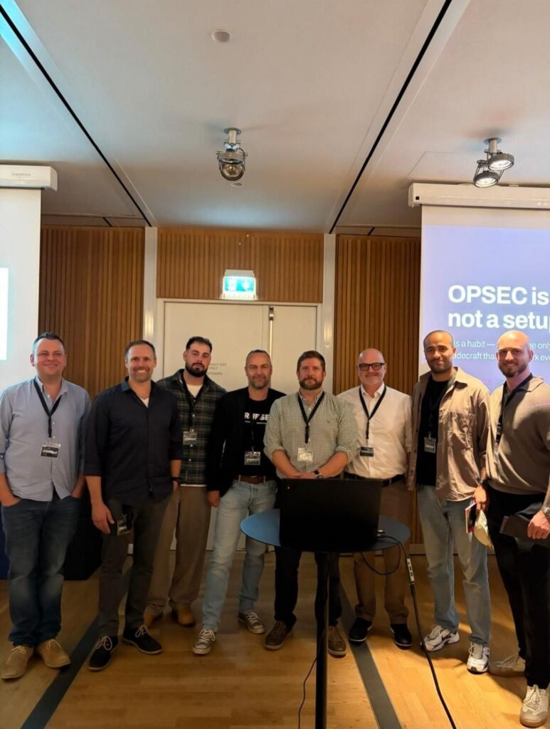Group photo with the OPSEC slide